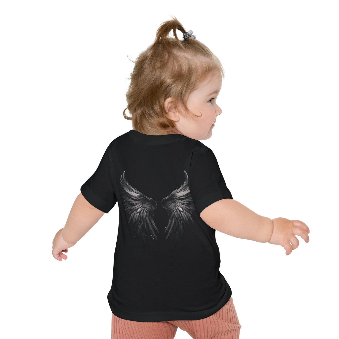 Child wearing a black t-shirt with angel wings design on a white background